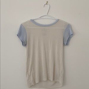 white top with blue collar and sleeves